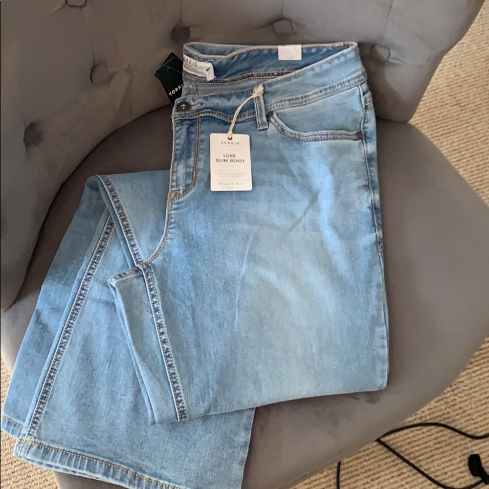 Torrid luxe slim boot cut faded denim